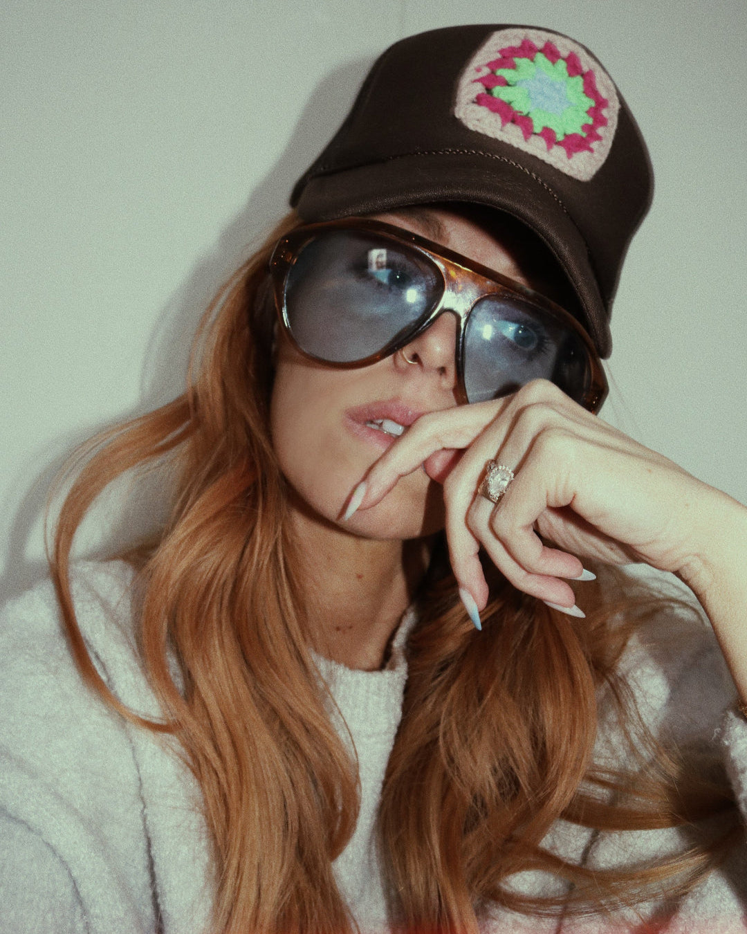 Brown trucker hat with neon granny square on female model Custom mesh hat for hippie beach hat for festival boho style