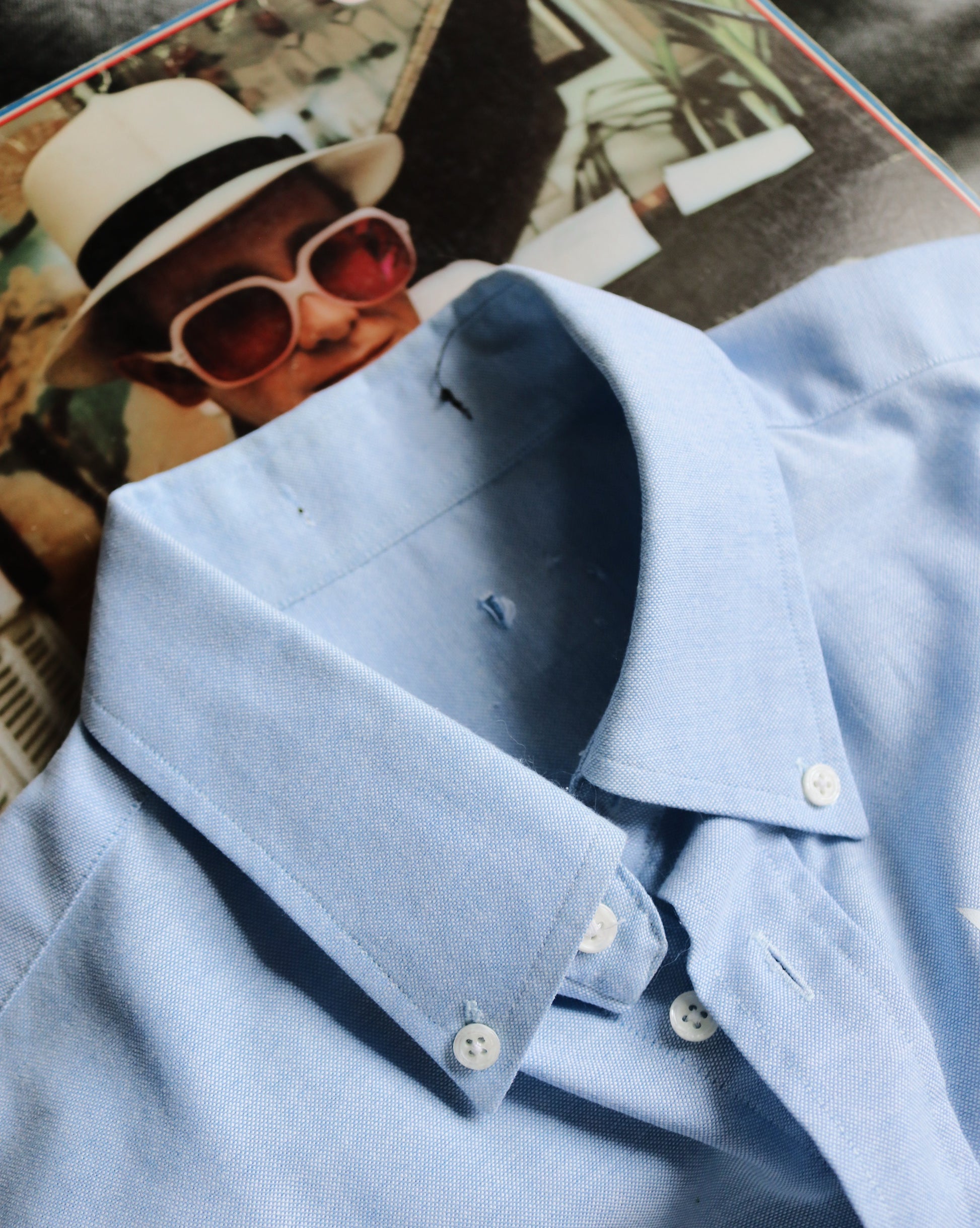 Close-up of a light blue shirt with a blurred background